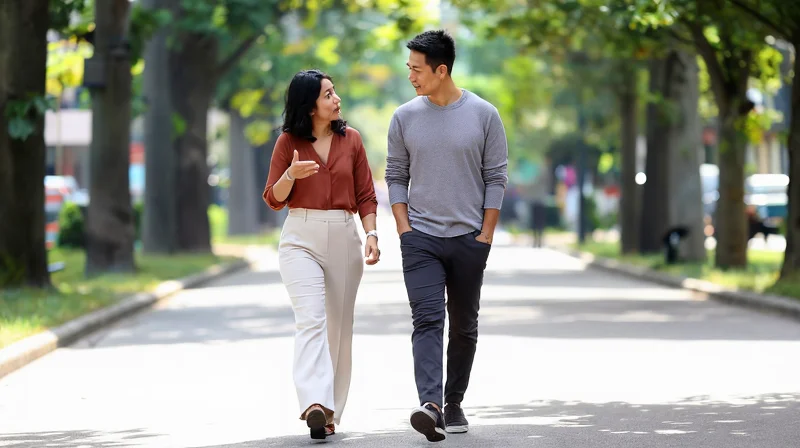 age gap dating couple walking together in a park, candid and natural
